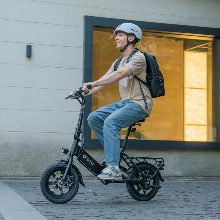 DYU C3 City E-Bike with rider on road